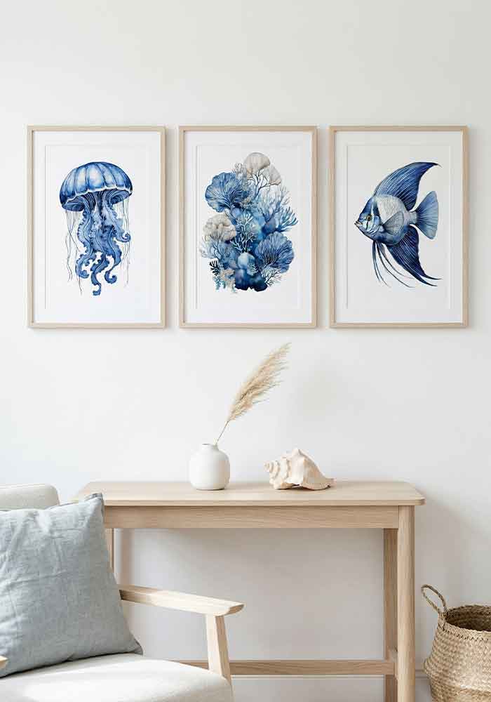 Delicate monochromatic watercolor illustration of a dzwon-shaped jellyfish with trailing tentacles in deep indigo blue, on a plain white background.