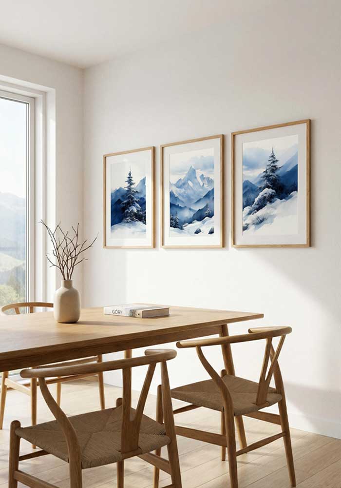 Panoramic watercolor triptych of blue misty mountains and snow-covered pine trees in a wide winter landscape.