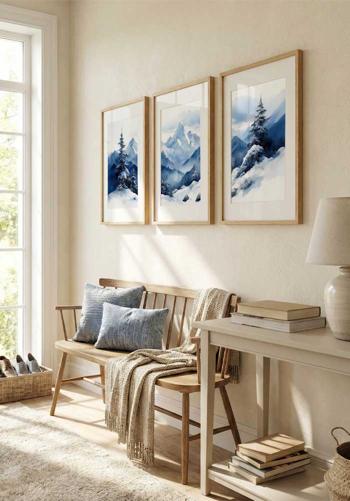 Panoramic watercolor triptych of blue misty mountains and snow-covered pine trees in a wide winter landscape.