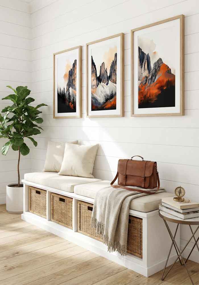 High-contrast watercolor triptych of dramatic mountain peaks with bright orange sunset light against dark black and grey shadows.